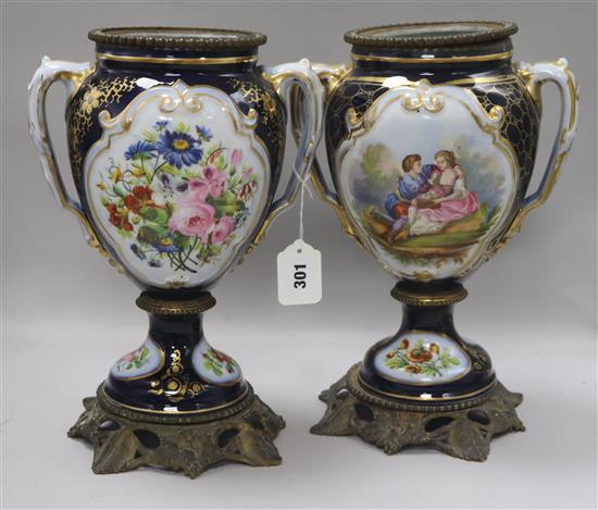 A pair of 19th century French porcelain urns, H 33cm